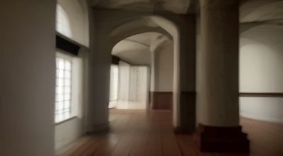 历史博物馆展厅内古代宗教仪式的文物展示，洗脚礼相关历史图像，文化氛围浓厚